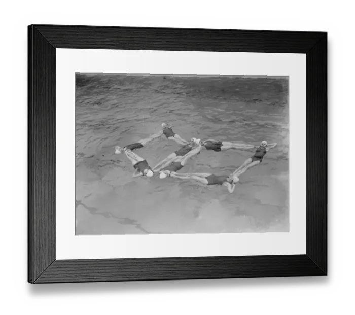 Framed Print : A synchronized swimming group perform a floating display at the opening for the new Framed Print : A synchronized swimming group perform a floating display at the opening for the new