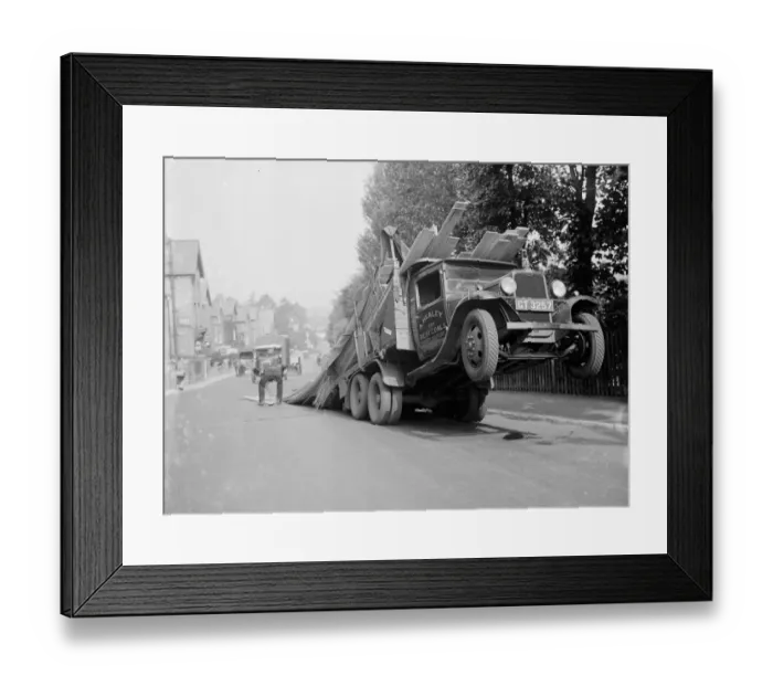 Framed Print : A lorry tips backwards, spilling its load in Sevenoaks, Kent. 1935 Framed Print : A lorry tips backwards, spilling its load in Sevenoaks, Kent. 1935