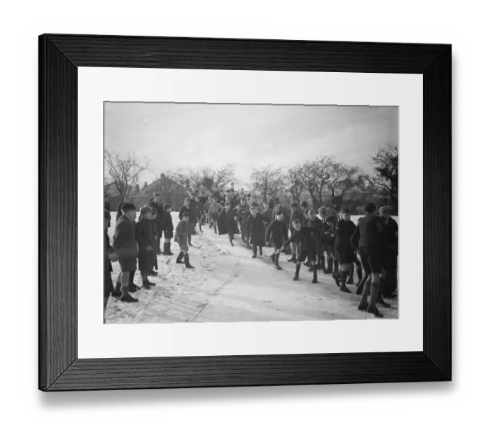 Framed Print : Schoolboys sliding on the snow in Orpington, Kent. 1937 Framed Print : Schoolboys sliding on the snow in Orpington, Kent. 1937