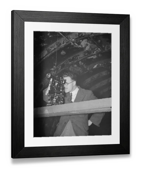 Framed Print : The construction of the Dartford Tunnel. An engineer takes readings with his theodolite Framed Print : The construction of the Dartford Tunnel. An engineer takes readings with his theodolite