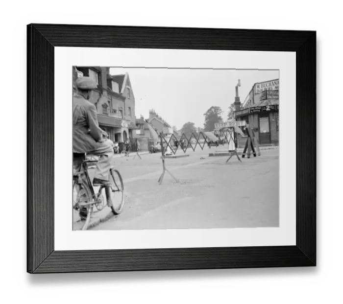 Framed Print : A cyclist negotiates a road barricade for road works in Bromley, Kent