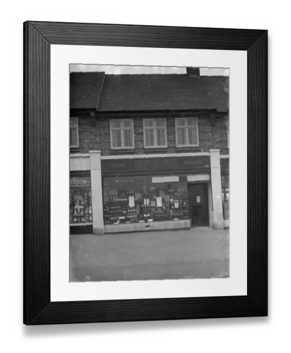 Framed Print : The shop front of Robins Off licence in Beckenham, Kent. 1 March 1936 Framed Print : The shop front of Robins Off licence in Beckenham, Kent. 1 March 1936