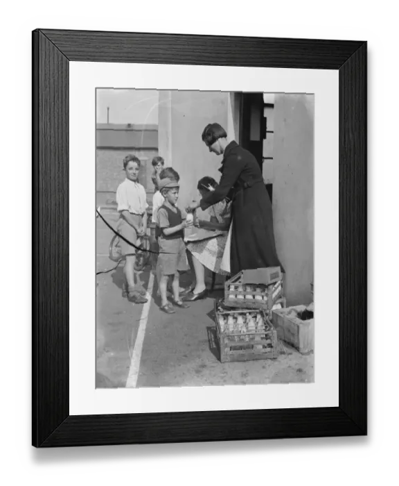 Framed Print : Free milk for children on holiday in Crayford, Kent. 1939 Framed Print : Free milk for children on holiday in Crayford, Kent. 1939