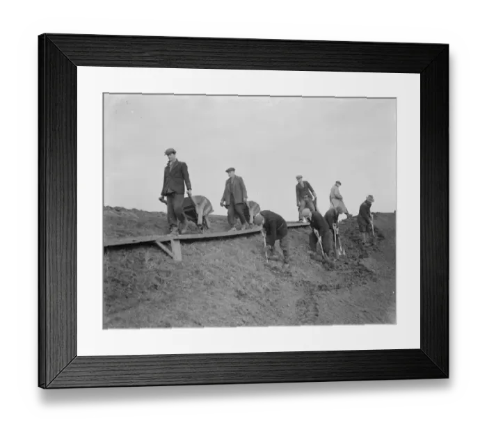 Framed Print : Workers increasing the river defences and doing repairs on the river wall and embankment Framed Print : Workers increasing the river defences and doing repairs on the river wall and embankment