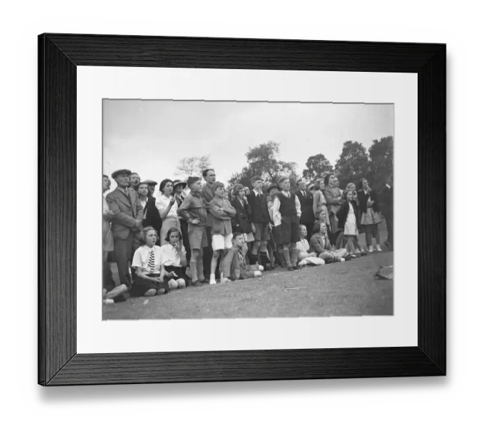 Framed Print : The crowd watching a trapeze artist performing at the Sidcup fete in Kent