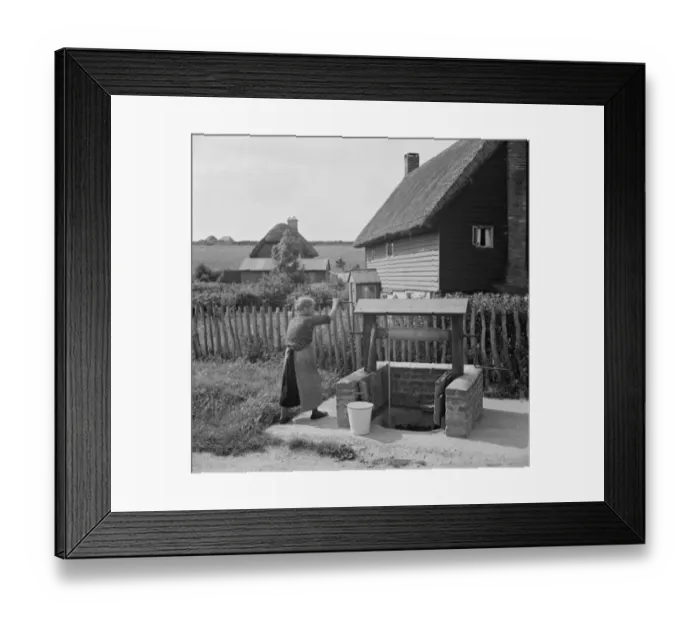 Framed Print : A woman using a water well in Deans Bottom. 1936 Framed Print : A woman using a water well in Deans Bottom. 1936
