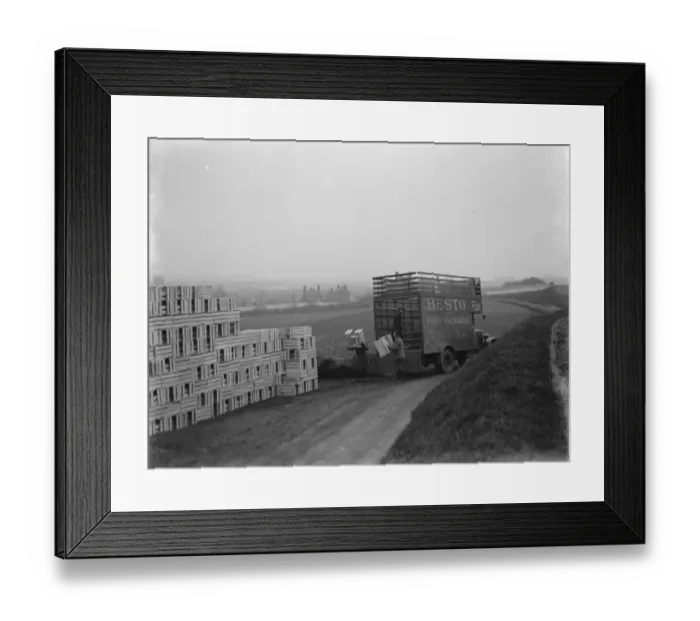 Framed Print : Unloading boxes from a truck which belongs to Besto the fruit packaging company from Kent Framed Print : Unloading boxes from a truck which belongs to Besto the fruit packaging company from Kent