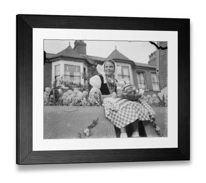 Framed Print : A young girl in traditional Dutch dress, part of the Dartford Carnival procession Framed Print : A young girl in traditional Dutch dress, part of the Dartford Carnival procession