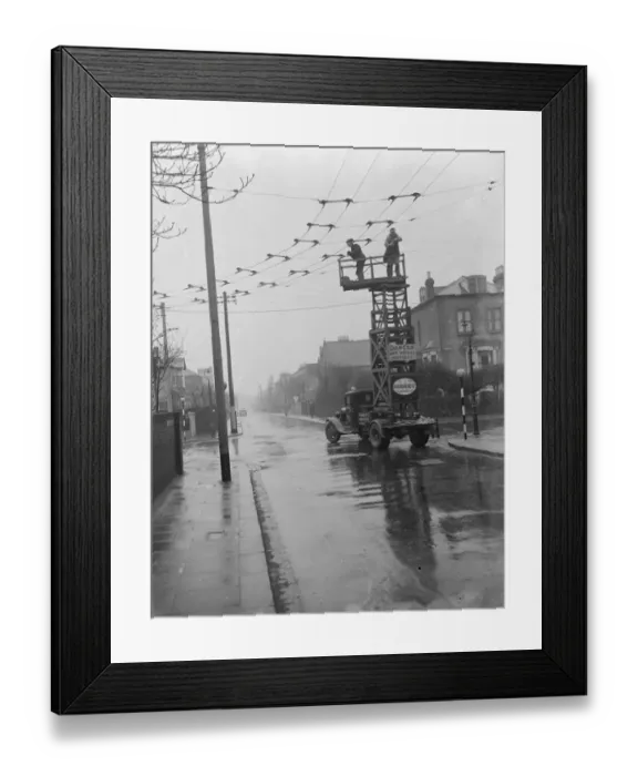 Framed Print : Workers from the Demolition and Construction Company Ltd use their Bedford Tram Tower