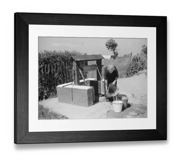 Framed Print : Rebecca Munday using a water well in Deans Bottom, Kent. 1939 Framed Print : Rebecca Munday using a water well in Deans Bottom, Kent. 1939