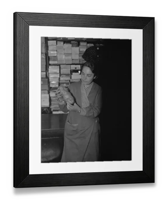 Framed Print : A woman holds up a giant potato in Farningham, Kent. 1937