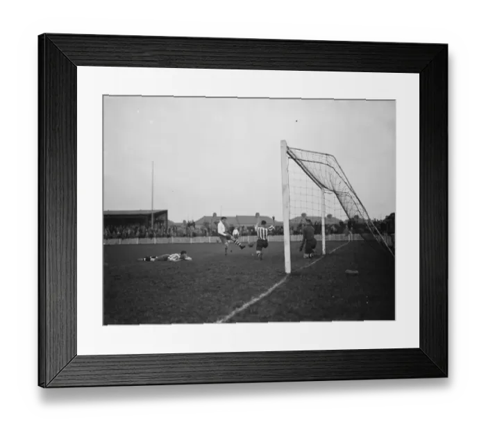 Framed Print : Dartford versus Leyton in the FA Cup. A defender throws himself in front of a shot