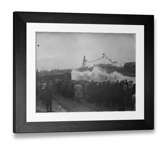Framed Print : Large waves as a ship is launched broadside down the slipway at Faversham, Kent Framed Print : Large waves as a ship is launched broadside down the slipway at Faversham, Kent