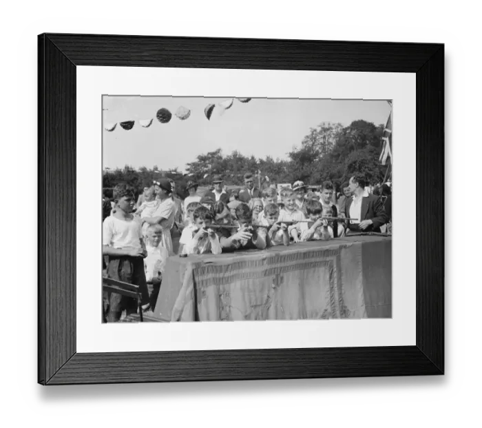 Framed Print : Eltham Roman catholic fete. Boys show their shooting ability on the air rifle range Framed Print : Eltham Roman catholic fete. Boys show their shooting ability on the air rifle range