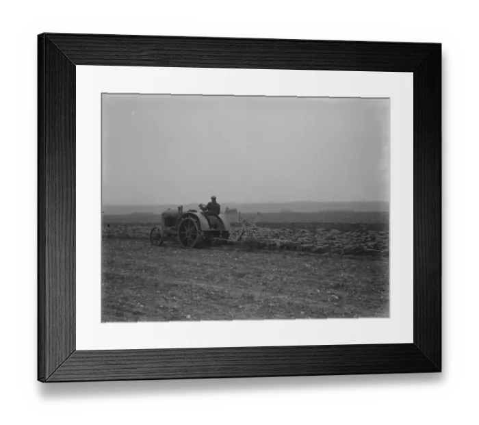 Framed Print : A farmer on a tractor ploughing a field near Swanley, Kent. 1936 Framed Print : A farmer on a tractor ploughing a field near Swanley, Kent. 1936