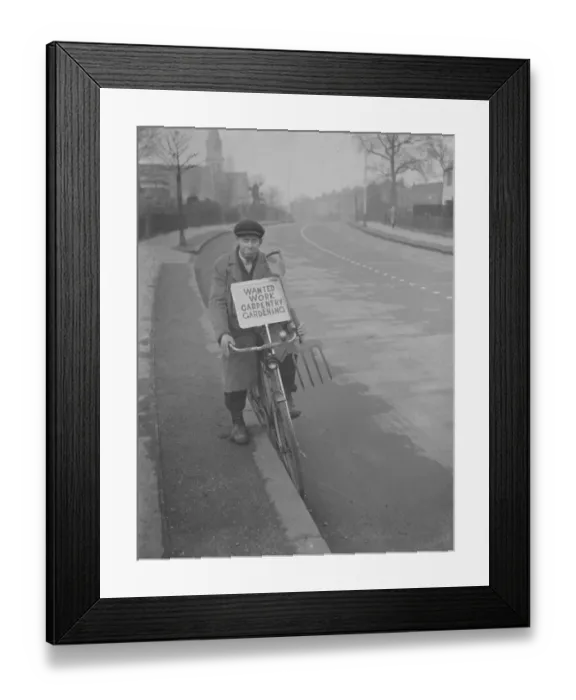 Framed Print : Mr F J Archer rides his bicycle with a placard advertising his services Framed Print : Mr F J Archer rides his bicycle with a placard advertising his services