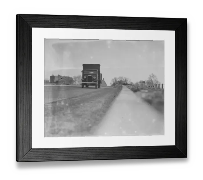 Framed Print : A lorry drives down the road - seen from the curb edge. 1936 Framed Print : A lorry drives down the road - seen from the curb edge. 1936