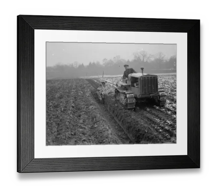 Framed Print : A ploughing demonstration with the new Melotte tractor fitted with continuous tracks Framed Print : A ploughing demonstration with the new Melotte tractor fitted with continuous tracks