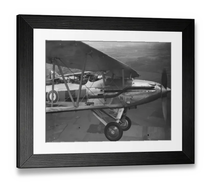 Framed Print : A Hawker Demon biplane of the RAF flying in formation over Kent. 1935 Framed Print : A Hawker Demon biplane of the RAF flying in formation over Kent. 1935