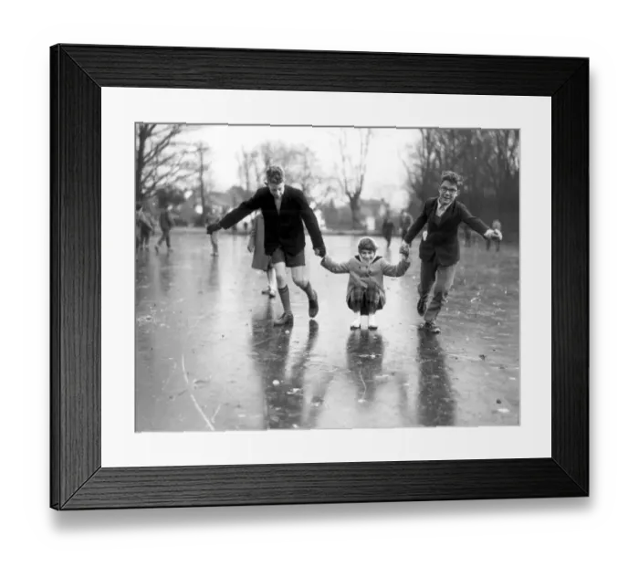 Framed Print : Having fun on the ice covered ponds at Chislehurst, Kent. The ice is about 12 inches Framed Print : Having fun on the ice covered ponds at Chislehurst, Kent. The ice is about 12 inches
