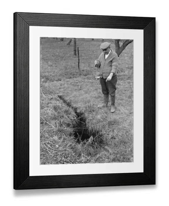 Framed Print : Mr Searles using a water diviner, points to where he believes water is available Framed Print : Mr Searles using a water diviner, points to where he believes water is available