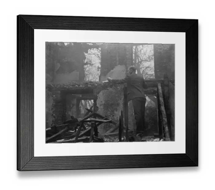 Framed Print : A man examines what is left behind following a cottage fire in Chelsfield, Kent Framed Print : A man examines what is left behind following a cottage fire in Chelsfield, Kent