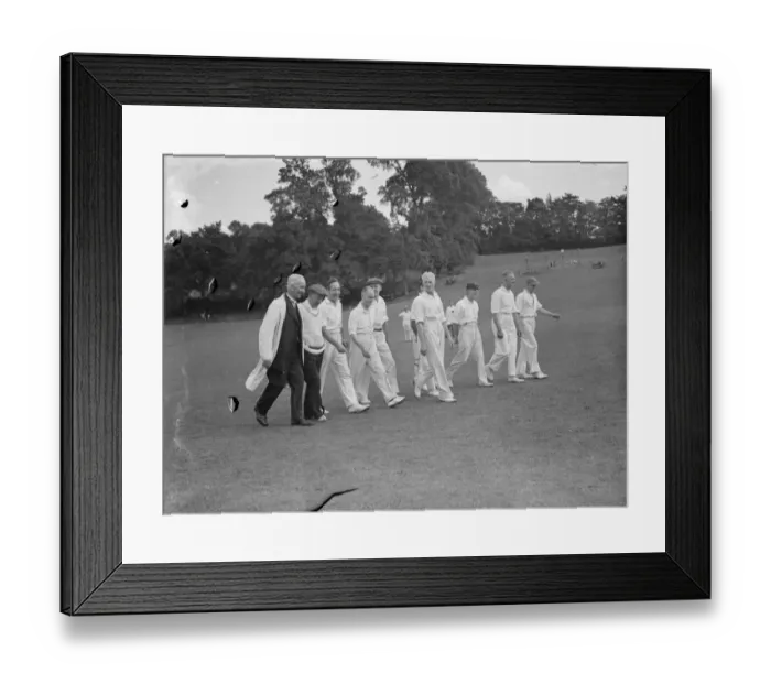 Framed Print : Cricket scenes in Wilmington, Kent. Veteran cricketers walk togeather. The veterans