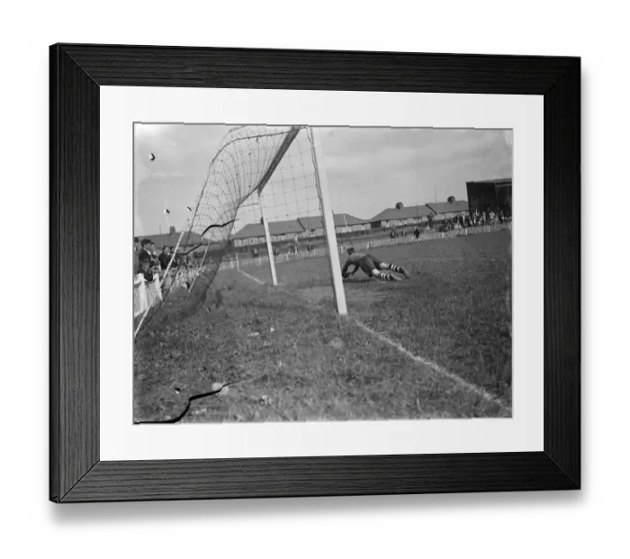 Framed Print : Dartford versus Guildford football match. Goal mouth action, the goalkeeper dives