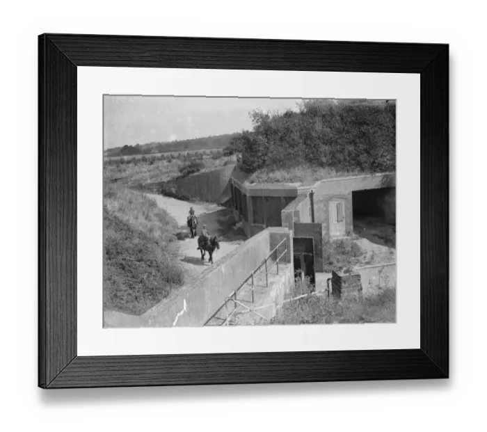 Framed Print : Farm workers ride work horses past old fort buildings on their farm at Farningham, Kent