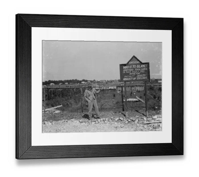 Framed Print : A man by a protest sign in a derelict site at Kingsdown, Kent. 1935
