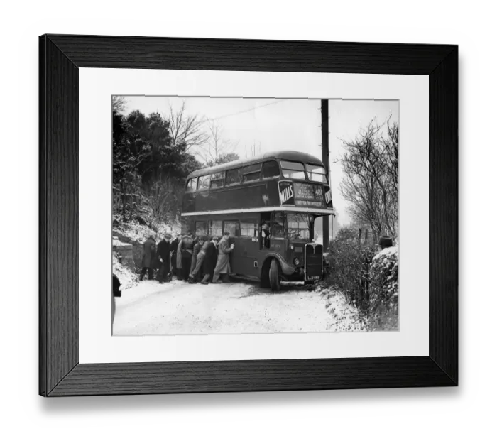 Framed Print : Ten men tried their hardest to push the bus straight again after it had skidded right Framed Print : Ten men tried their hardest to push the bus straight again after it had skidded right