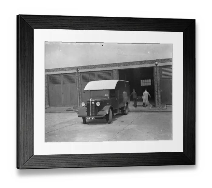 Framed Print : Men carrying the totalisators from a Bedford truck at Hurst Park Racecourse in Molesey Framed Print : Men carrying the totalisators from a Bedford truck at Hurst Park Racecourse in Molesey