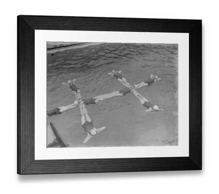 Framed Print : A synchronized swimming group perform a floating display at the opening for the new Framed Print : A synchronized swimming group perform a floating display at the opening for the new