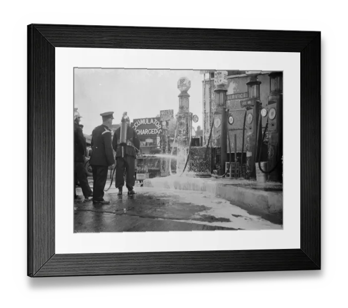 Framed Print : The fire brigade dealing with a fire at the garage on Halfway Street, Sidcup, Kent