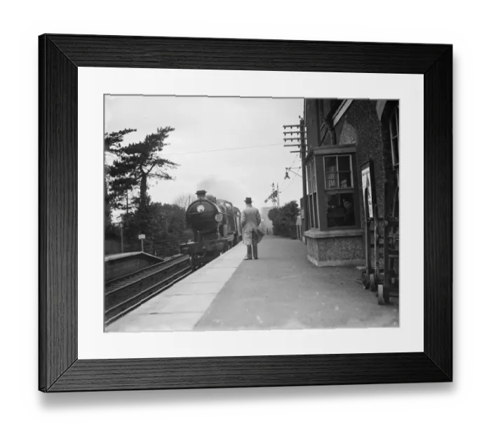 Framed Print : A train worker sits in the signal box on the train platform. 1936 Framed Print : A train worker sits in the signal box on the train platform. 1936