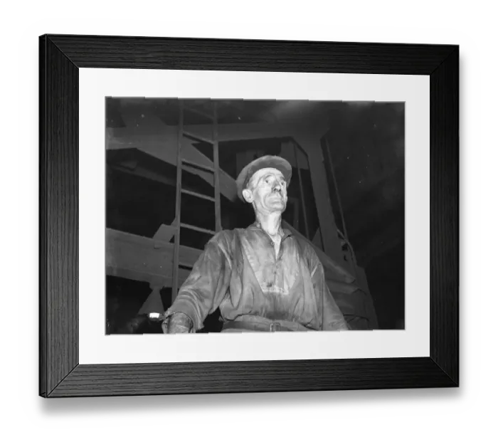 Framed Print : Gravesend Gasworks in Kent. A retort minder. 1939 Framed Print : Gravesend Gasworks in Kent. A retort minder. 1939