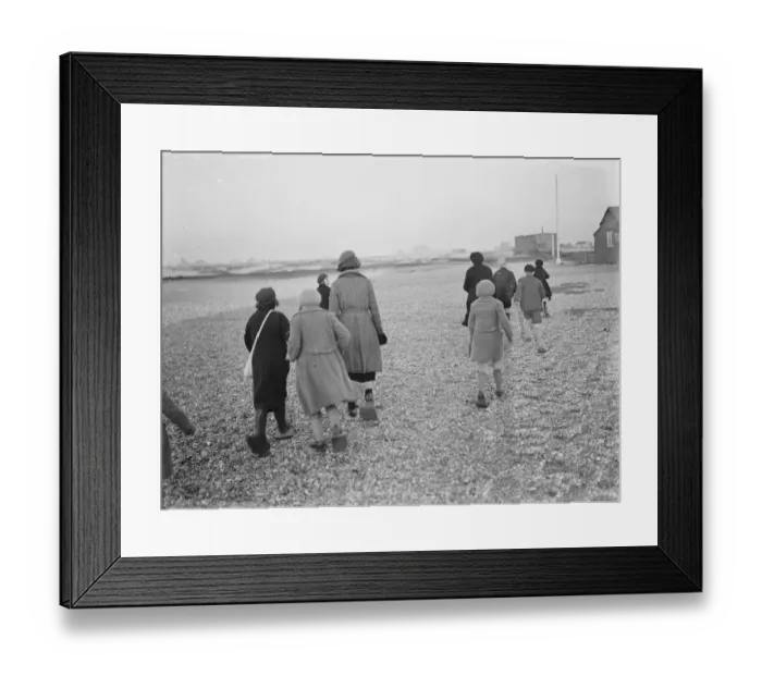 Framed Print : Children playing on the shingle beach at Dungeness. They use beach shoes to walk Framed Print : Children playing on the shingle beach at Dungeness. They use beach shoes to walk