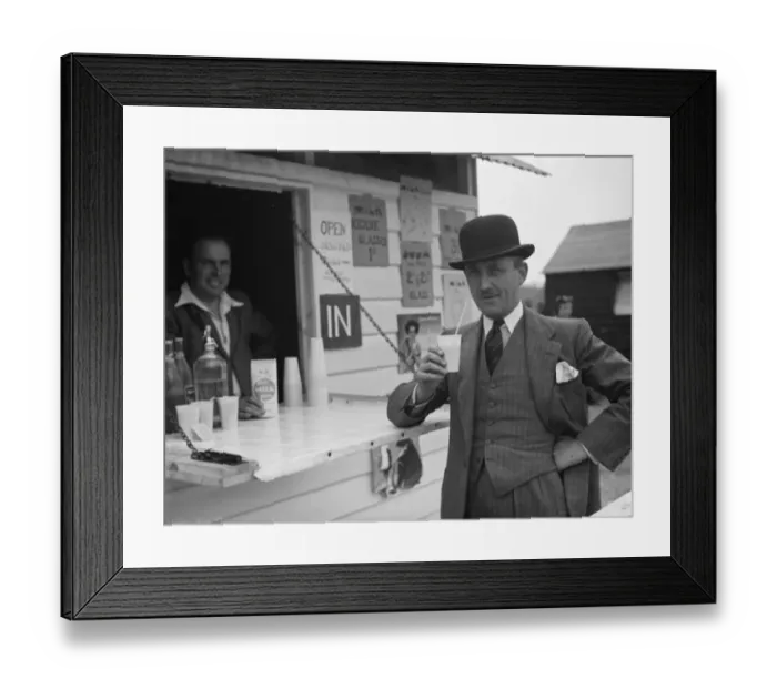 Framed Print : Whitbreads hop farm in Belting, Kent. A gentleman enjoys a cup of milk Framed Print : Whitbreads hop farm in Belting, Kent. A gentleman enjoys a cup of milk