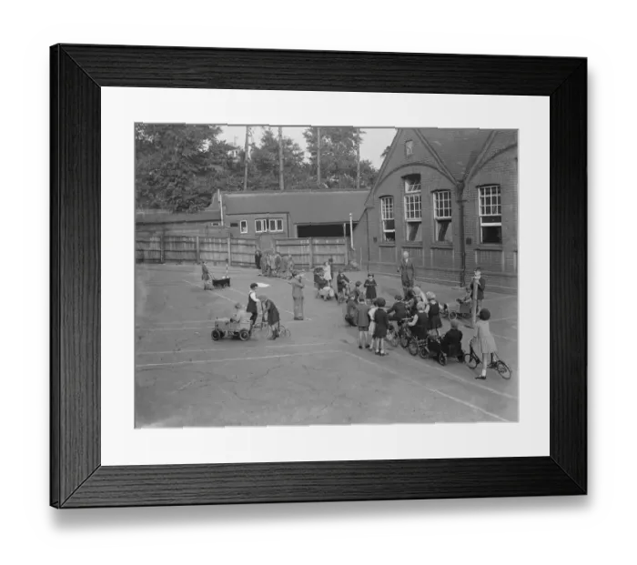 Framed Print : Children receive traffic instructions on the playground of their Sidcup Hill School