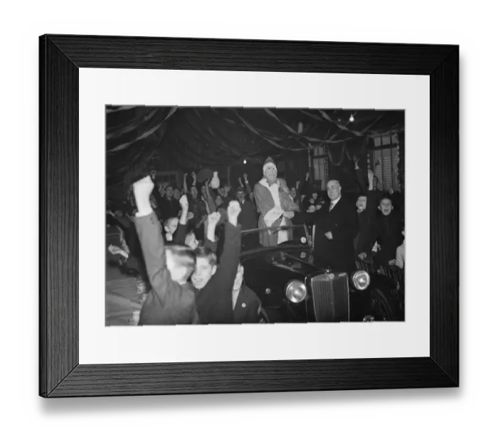Framed Print : An enthusiastic welcome for Father Christmas as he arrives at a childrenss breakfast Framed Print : An enthusiastic welcome for Father Christmas as he arrives at a childrenss breakfast