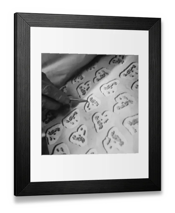 Framed Print : Block making in WIlmington. MR G E Campbell carving out dog head patterns