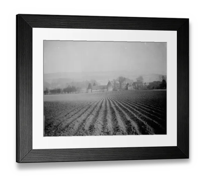 Framed Print : A view over a ploughed field to an Oast house at Otford in Kent. 1938 Framed Print : A view over a ploughed field to an Oast house at Otford in Kent. 1938