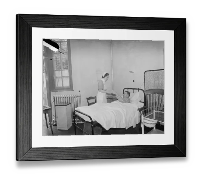 Framed Print : The Sidcup Cottage Hospital in Kent. A nurse tends to Mr Frank Ager, a patient Framed Print : The Sidcup Cottage Hospital in Kent. A nurse tends to Mr Frank Ager, a patient
