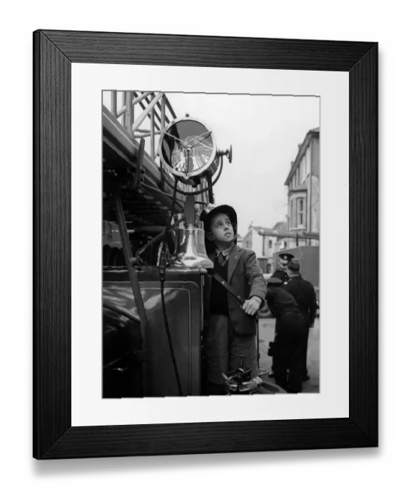 Framed Print : Fireman for a day Bernard Meaden, aged 10, of Bromley, Kent, has a thrill in his Framed Print : Fireman for a day Bernard Meaden, aged 10, of Bromley, Kent, has a thrill in his