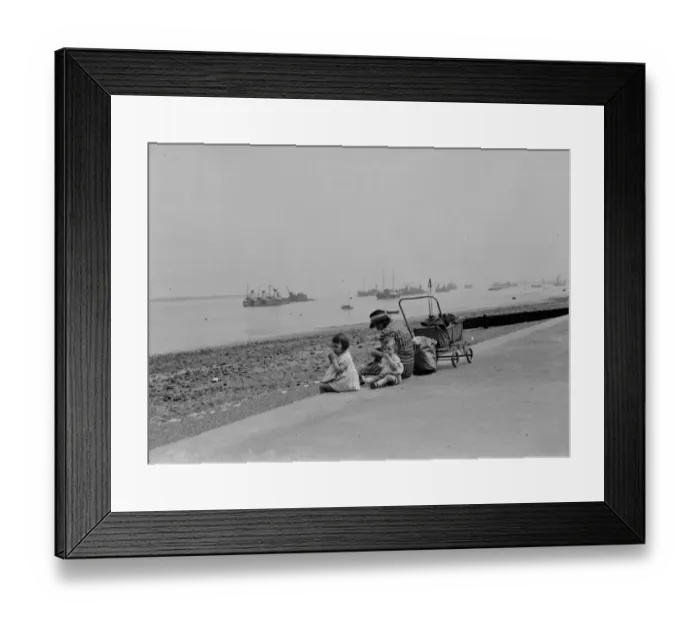 Framed Print : Children sit on the promenade at Gravesend river front and look out over the Thames Framed Print : Children sit on the promenade at Gravesend river front and look out over the Thames