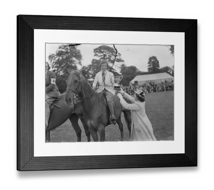 Framed Print : Horse jumping at the Bexleyheath Gala in Kent. The winner receives a cup after Framed Print : Horse jumping at the Bexleyheath Gala in Kent. The winner receives a cup after