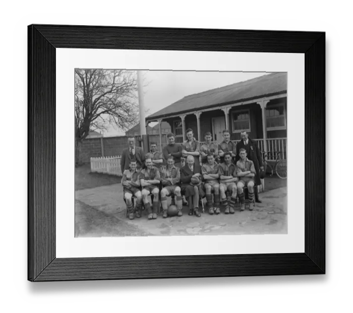 Framed Print : A football team, part of the Kent County Junior Cup, pose for a group photo