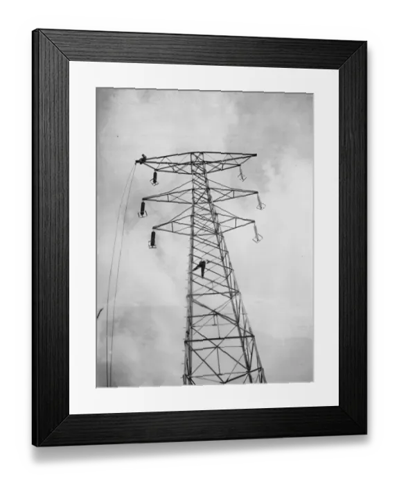 Framed Print : Erecting electricity pylon wires on a grid in Gravesend, Kent. 1939