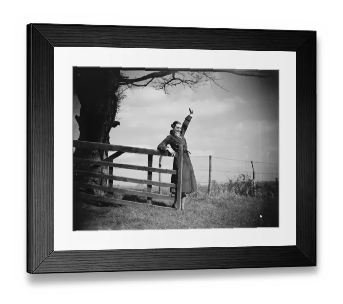 Framed Print : Muriel Haken waves from a gate. 1939 Framed Print : Muriel Haken waves from a gate. 1939