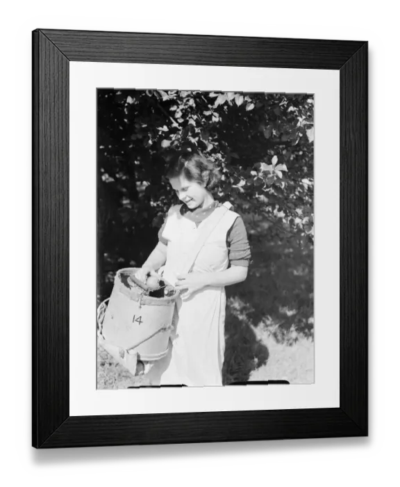Framed Print : East Malling Research Station open day. Girl with a fruit bucket. 1937